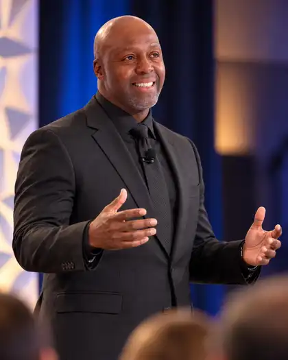 Dr. Kevin André Smith speaking on stage